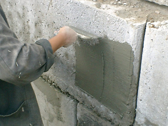 Выбор смеси для оштукатуривания стен из шлакоблока на фасаде